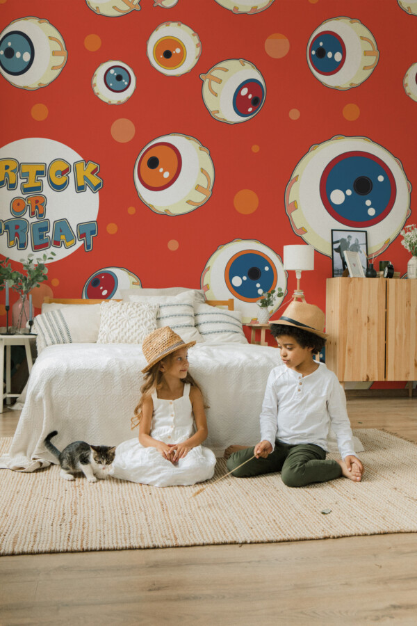 Trick or Treat Eyes wall mural by Fancy Walls featuring playful cartoon eyeballs on orange background peel and stick wall mural