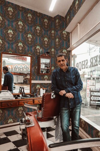 Fancy Walls traditional wallpaper featuring vintage Victorian skull motifs in brown.