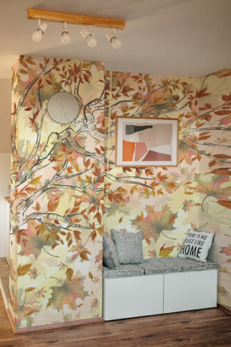 Fancy Walls Maple Falling Leaves wall mural peel and stick showing a delicate autumn tree with scattered leaves and soft beige background