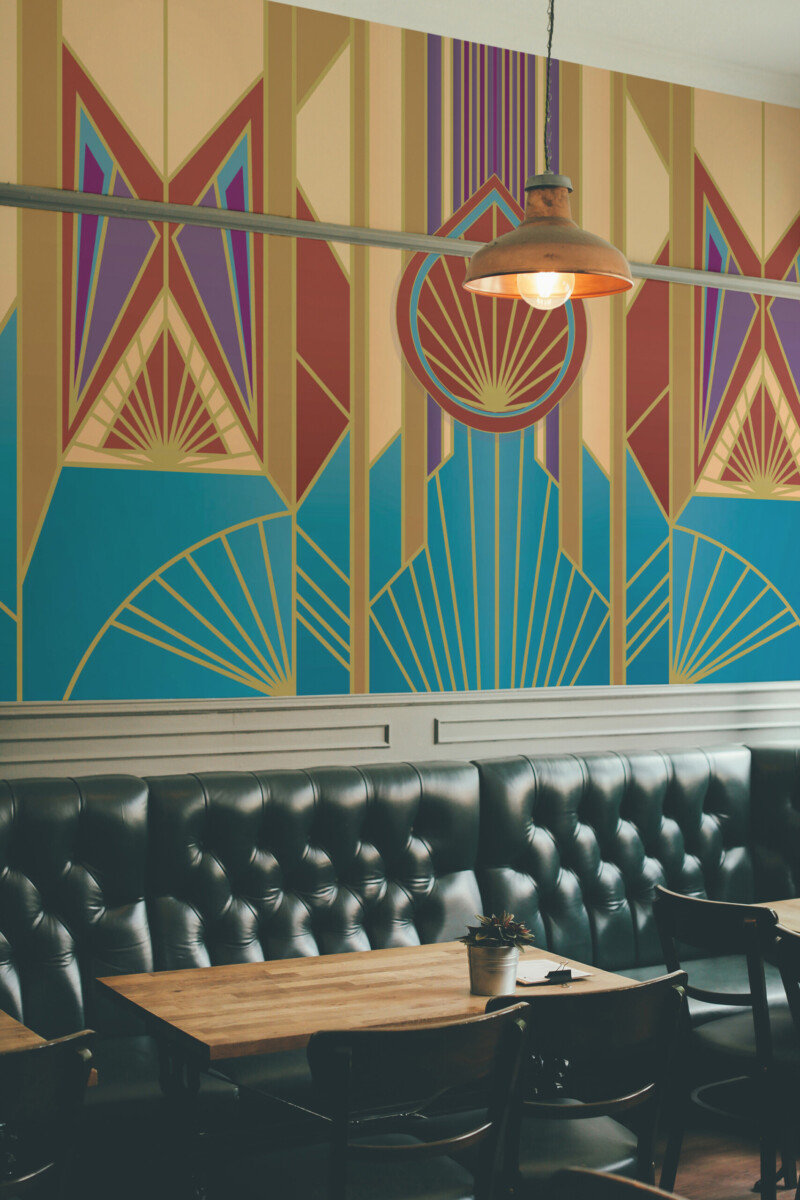 Fancy Walls Art Deco Burst wall mural showcasing radiant patterns in red, gold, blue, and purple hues.