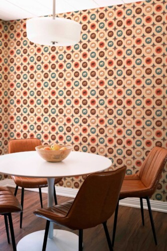 Fancy Walls self-adhesive wallpaper featuring terracotta elephant medallions for a warm bohemian space.