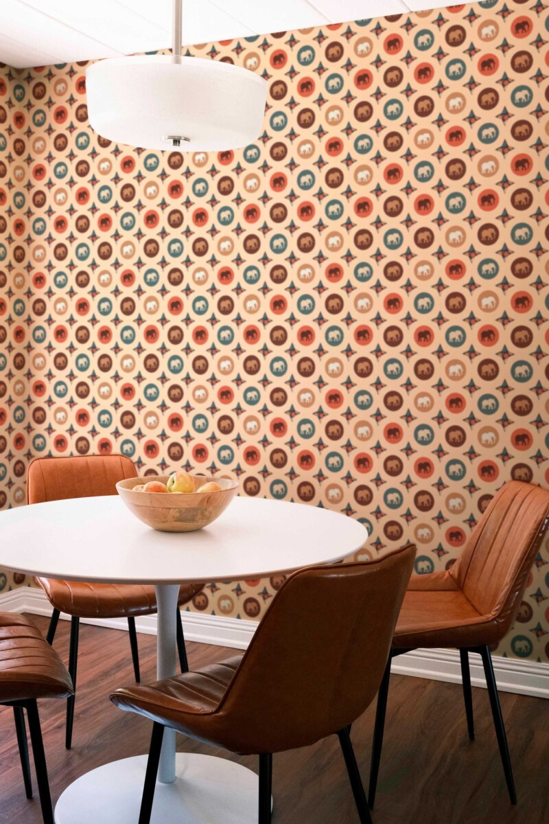 Fancy Walls self-adhesive wallpaper featuring terracotta elephant medallions for a warm bohemian space.