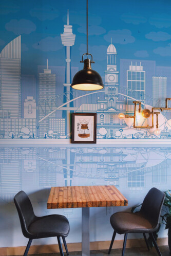 Fancy Walls Sidney Skyline peel and stick wall mural with blue line art Sydney buildings and reflection.