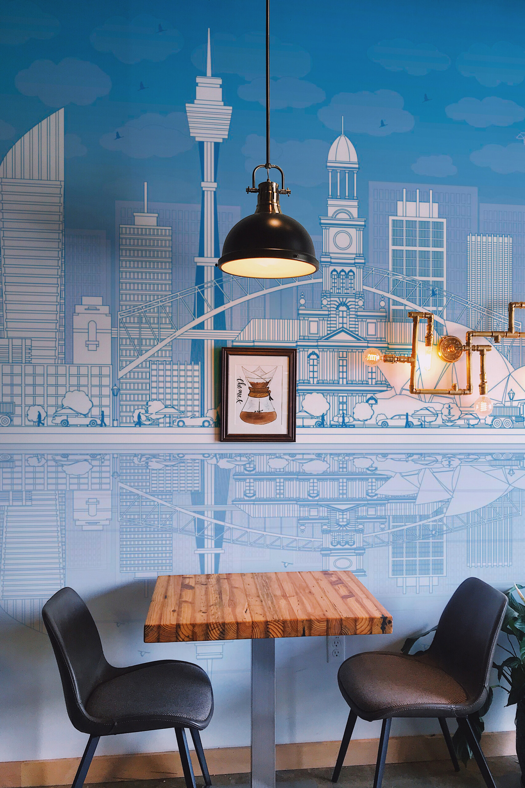 Fancy Walls Sidney Skyline peel and stick wall mural with blue line art Sydney buildings and reflection.