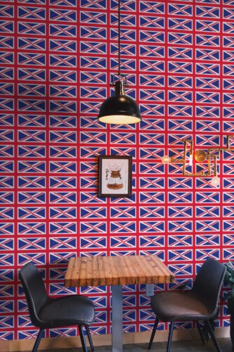 Fancy Walls peel and stick wallpaper featuring a bold full-field UK flag in blue red and white.