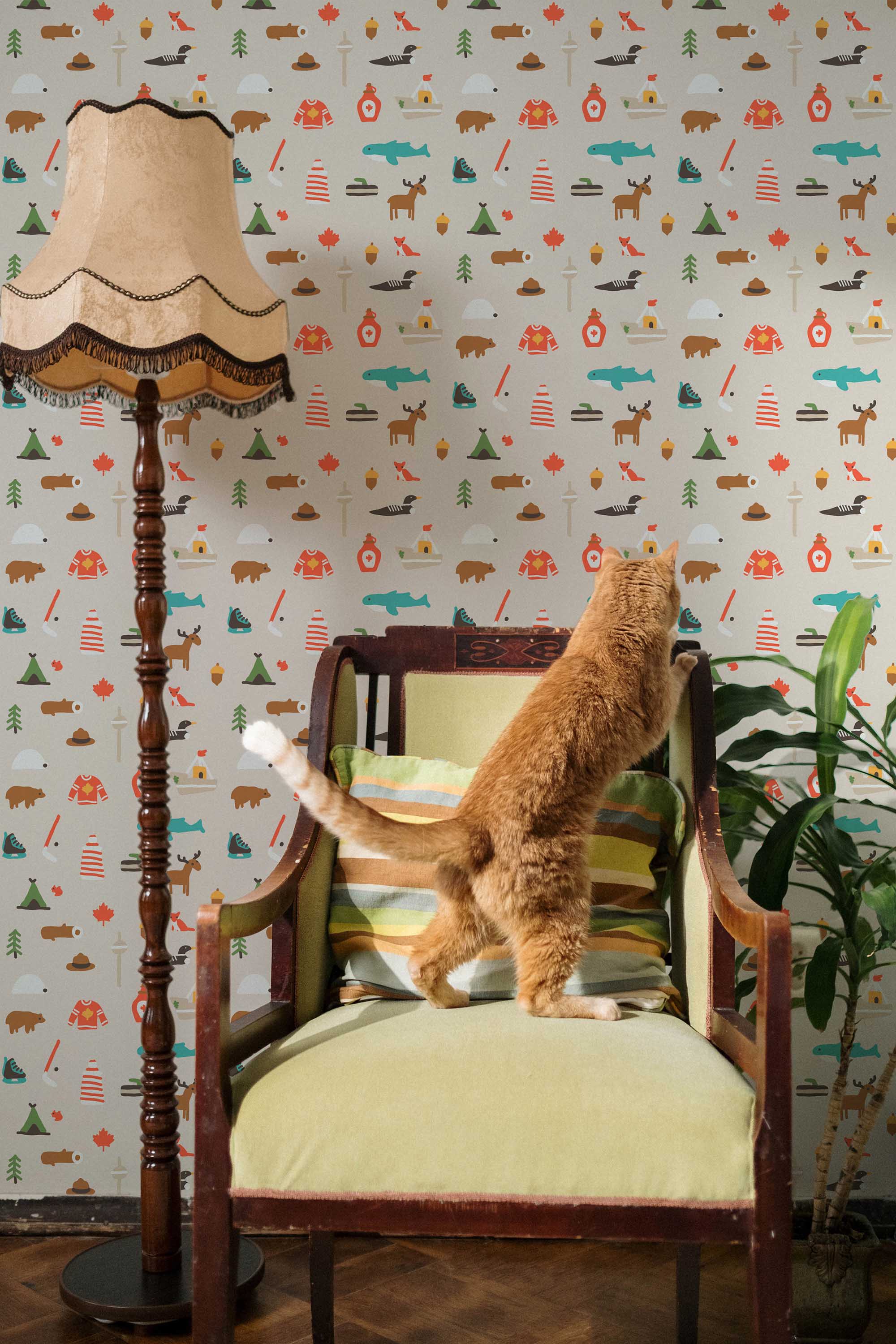 Fancy Walls removable wallpaper showcasing playful illustrated Canadian motives in warm grays.