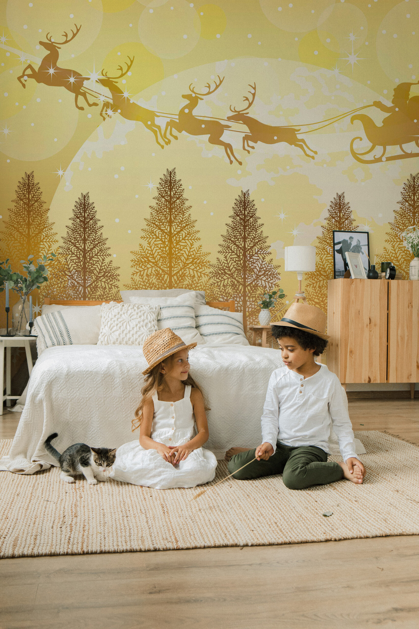 Fancy Walls Christmas Magic peel and stick wall mural with golden holiday landscape and flying sleigh.