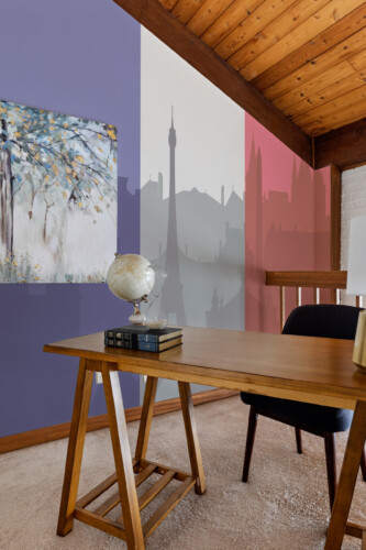 Fancy Walls Paris Tricolor Cityscape peel and stick wall mural with soft gray skyline and France flag overlay.