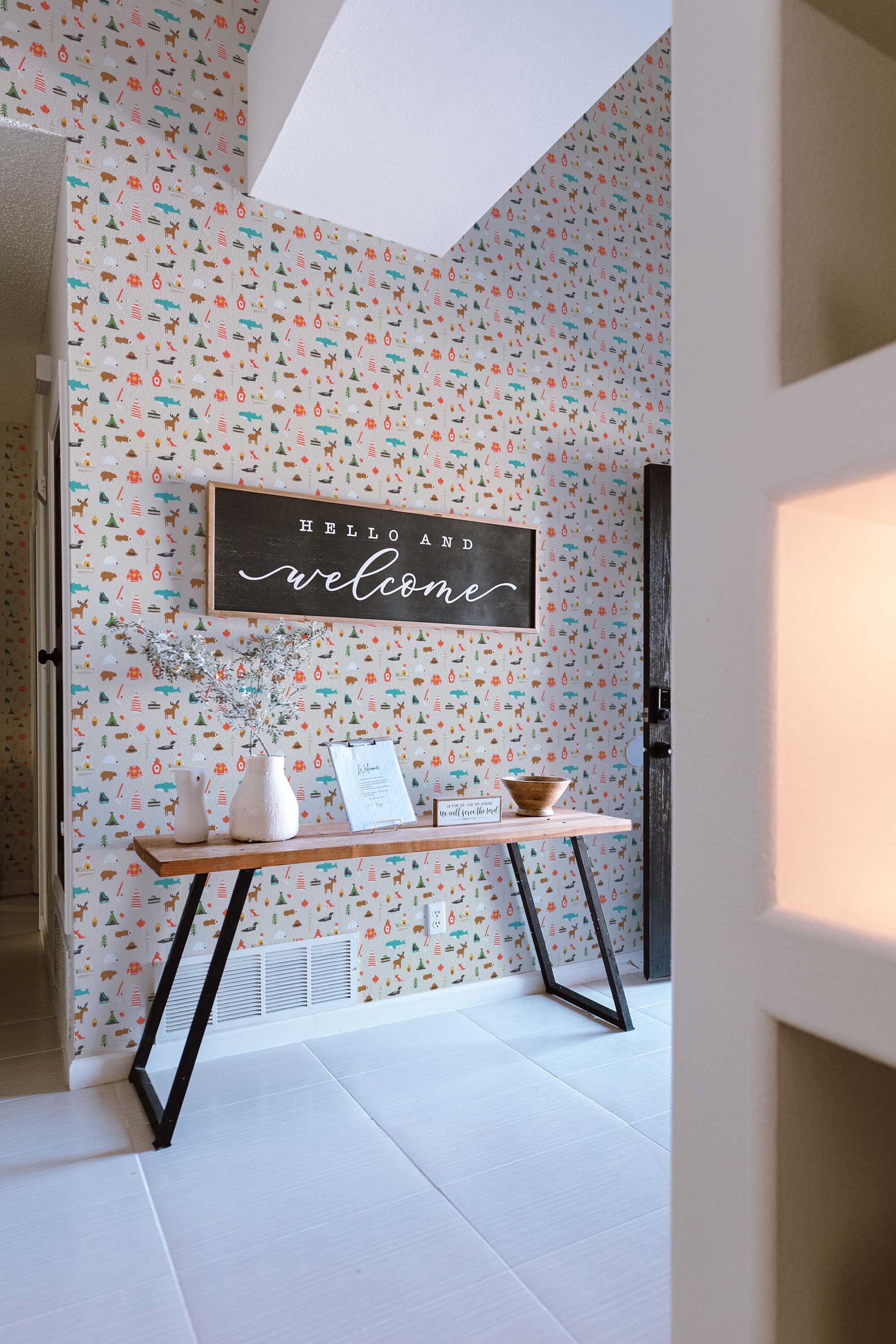 Fancy Walls traditional wallpaper with illustrated gray Canadian icons for a playful look.