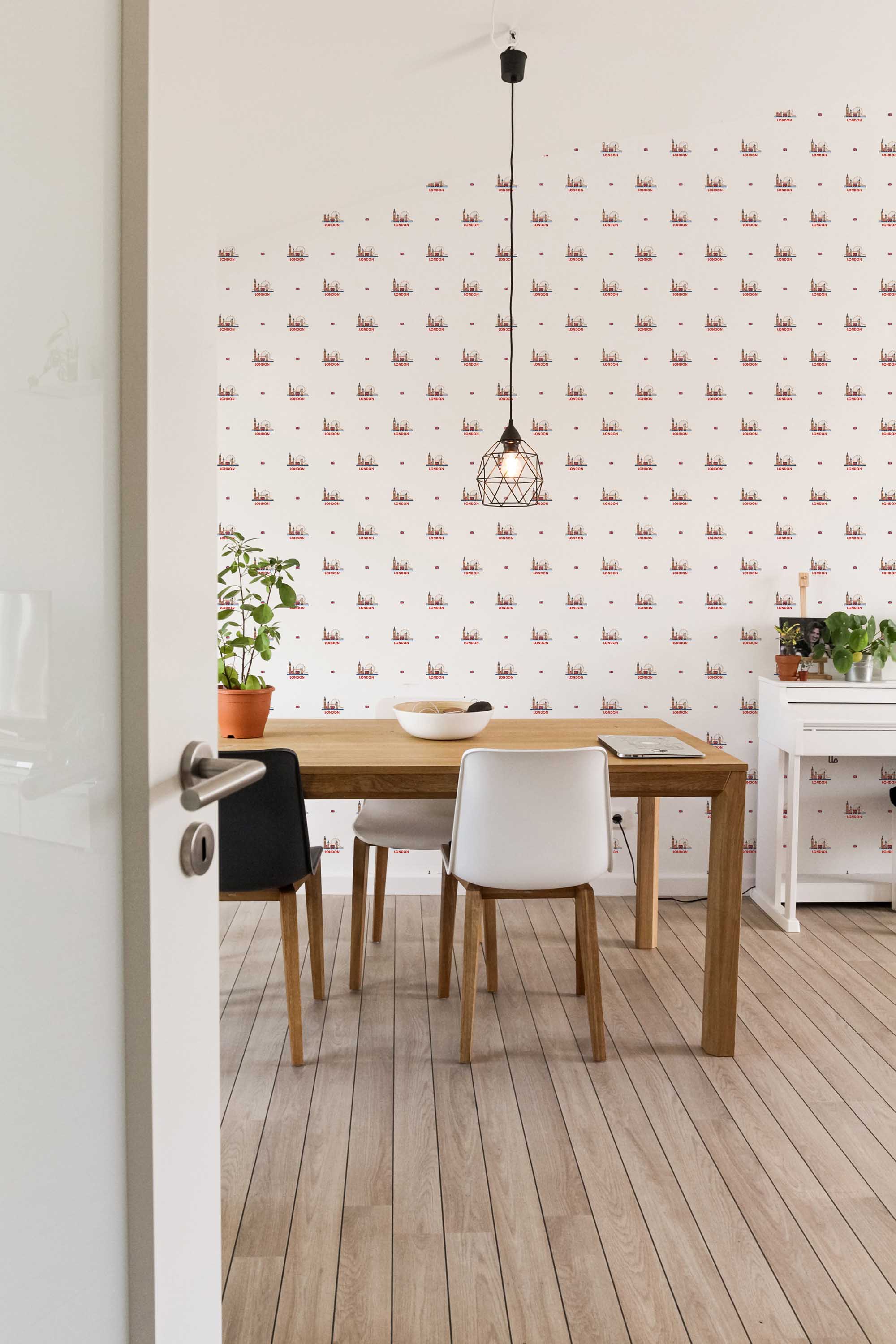 Fancy Walls removable wallpaper with refined London skyline details in muted tones.