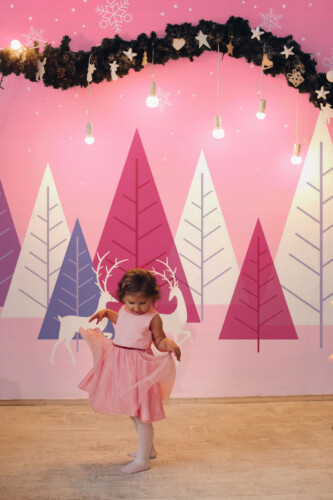 Fancy Walls Preppy Winter Landscape wall mural with geometric winter scene in soft pink.