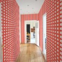 Fancy Walls self-adhesive wallpaper featuring bold red maple flag stripe accents.