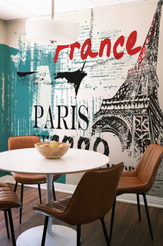Fancy Walls Eiffel Tower Graffiti peel and stick wall mural with teal brushstrokes and bold Paris typography.