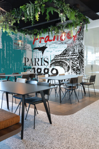 Fancy Walls Eiffel Tower Graffiti wall mural peel and stick featuring expressive teal splashes and sketchy tower illustration.