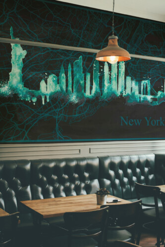 Fancy Walls Turquoise New York Map removable wall mural showing artistic turquoise skyscrapers and modern New York map.