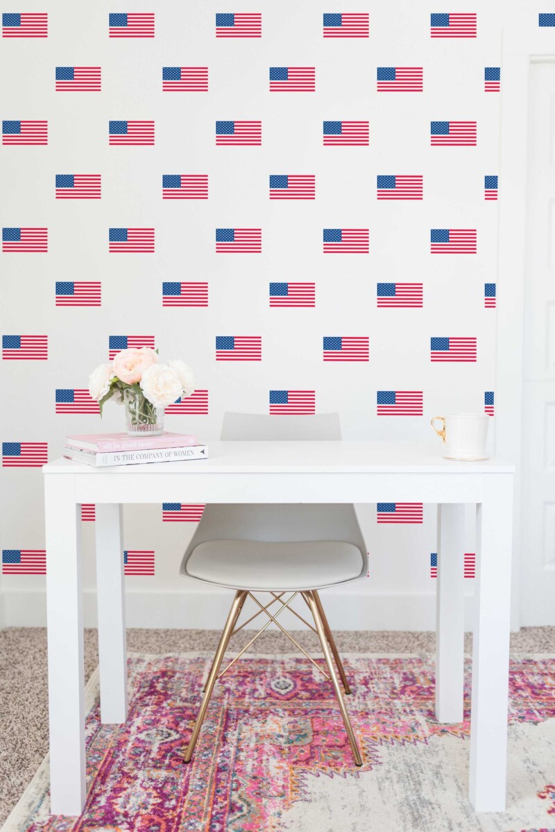 Fancy Walls traditional wallpaper featuring scattered USA flag graphics for a timeless national look.