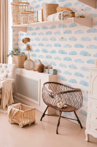 Fancy Walls peel and stick wallpaper featuring soft watercolor clouds in blue and white for a calming sky-themed interior.
