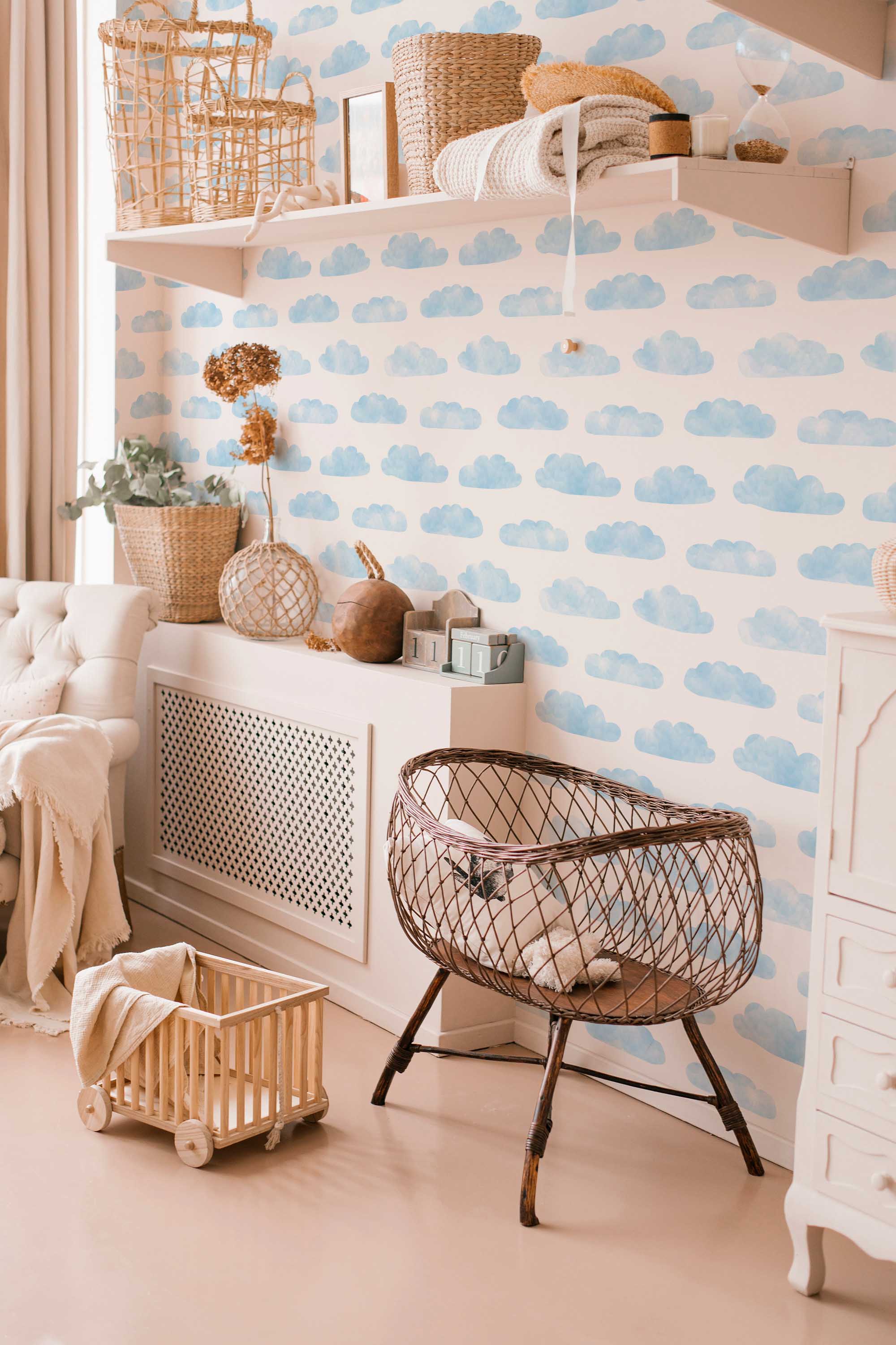 Fancy Walls peel and stick wallpaper featuring soft watercolor clouds in blue and white for a calming sky-themed interior.