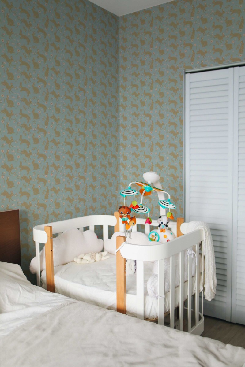 Fancy Walls traditional wallpaper displaying neutral boho bunnies with subtle blue accents for a fresh modern nursery feel.