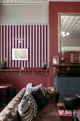Fancy Walls peel and stick wallpaper with modern blue and burgundy striped pattern creating a bold high-contrast look for contemporary interiors.