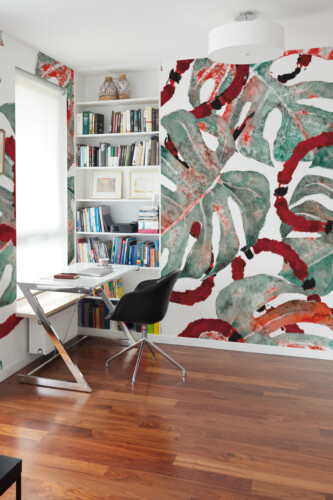 Exotic Monstera Snakes wall mural brings tropical elegance and bold watercolor artistry to modern décor with lush green leaves and red serpent details.