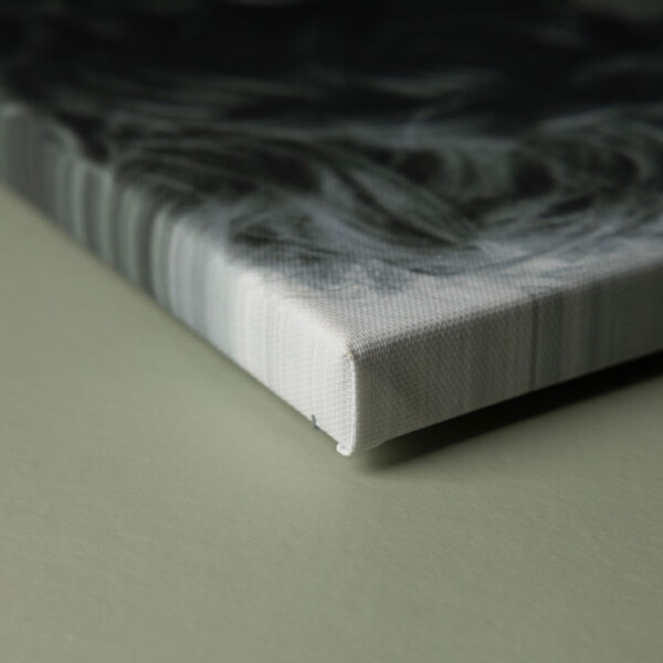 Close-up of a stretched edge canvas showing image wrapped around the side