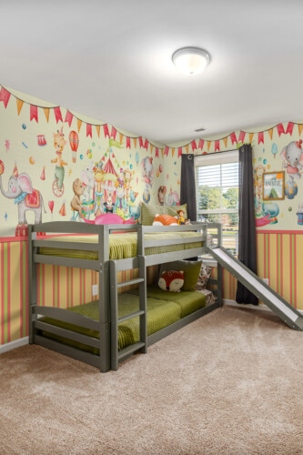 Little Circus Adventure peel and stick wall mural featuring playful animals and soft pastel tones for nursery décor.