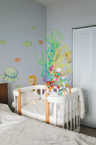 Playful Undersea Friends peel and stick wall mural featuring cheerful fish, seahorses, and coral reefs — PVC-free and eco-friendly removable wallpaper mural.