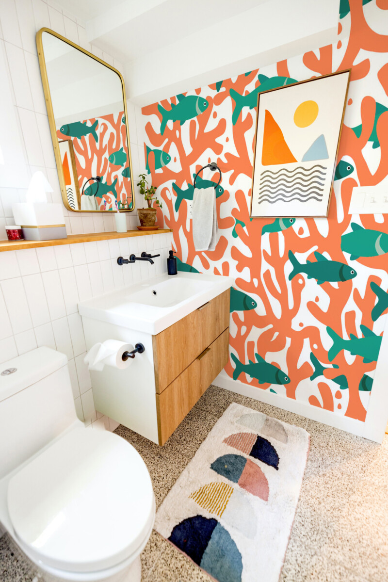 Fancy Walls Fishes and Corals peel and stick wall mural with teal fish and orange coral branches.