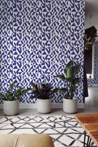 Fancy Walls self-adhesive wallpaper with abstract navy blue geometric triangle repeats for a striking interior.