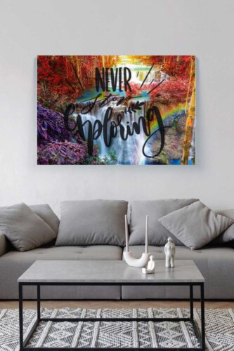Never Stop Exploring premium canvas print with colorful waterfall landscape and inspirational quote, ideal for home office or creative décor. Fancy Walls hand-stretched canvas.