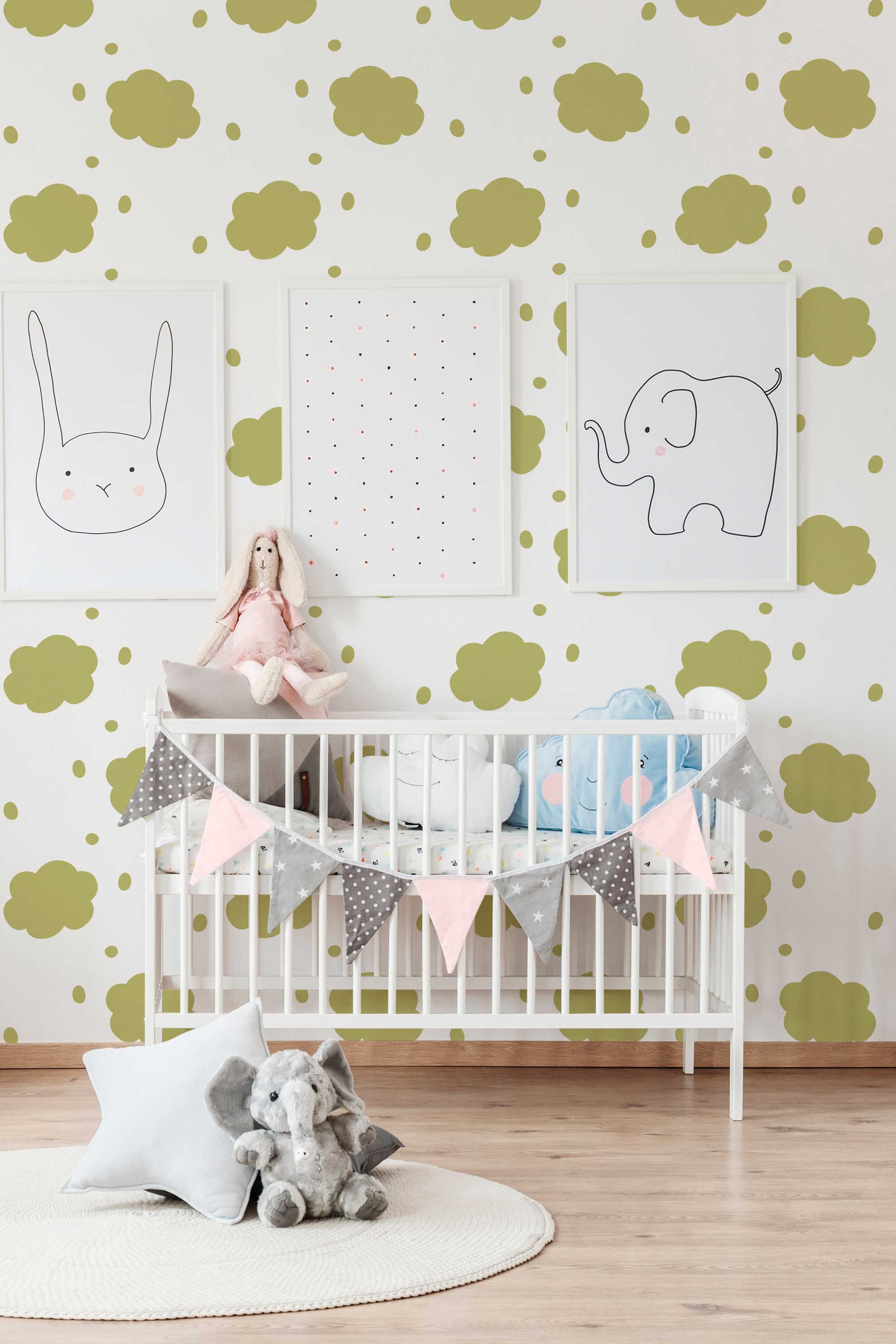 Fancy Walls peel and stick wallpaper with olive green watercolor clouds for a soothing neutral nursery look.