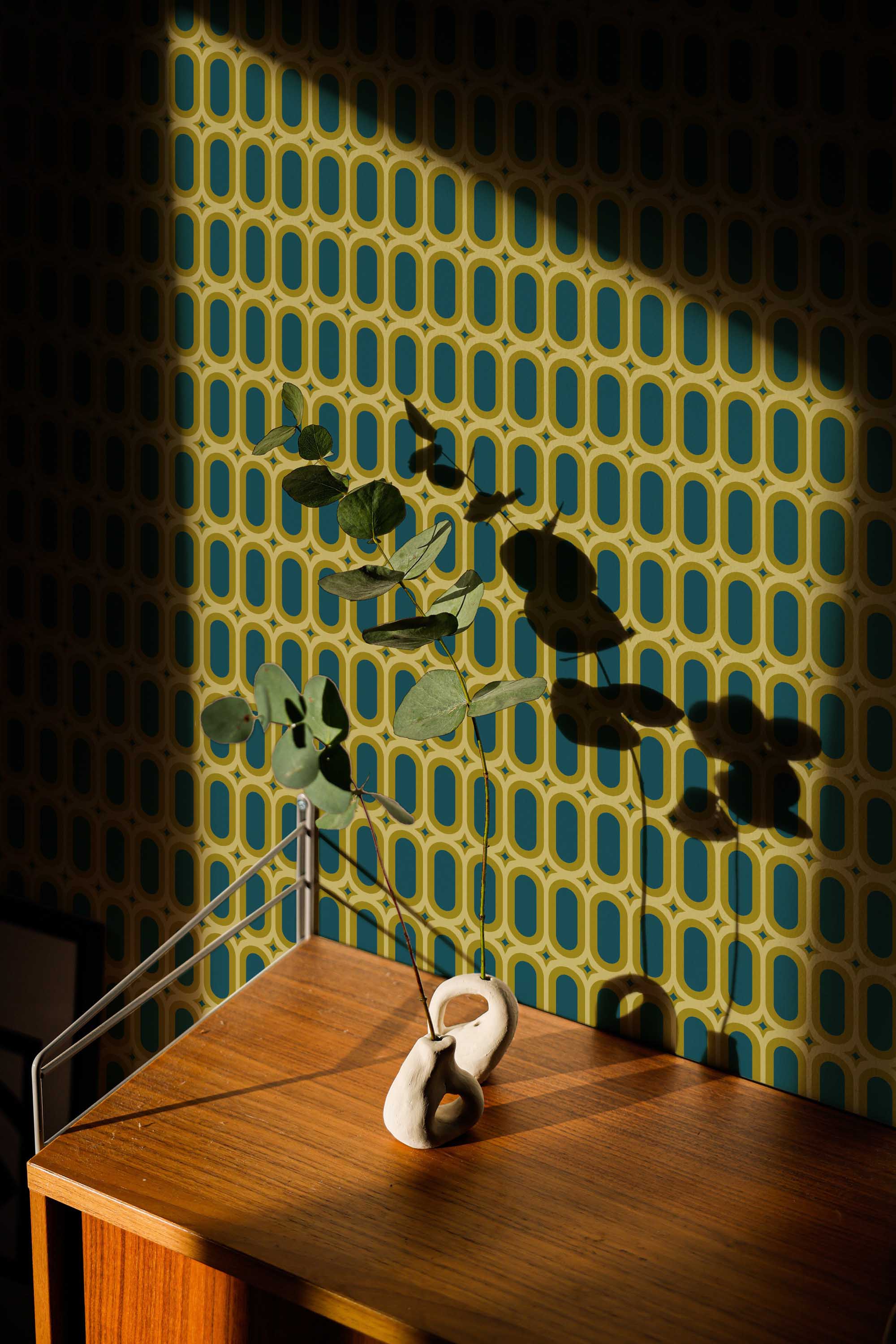 Fancy Walls traditional wallpaper featuring vintage olive green geometric ovals for a bold retro interior.