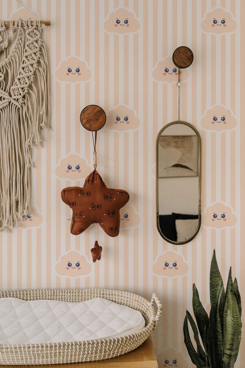 Fancy Walls peel and stick wallpaper with smiling peach clouds and neutral stripes for a soft minimal nursery style.