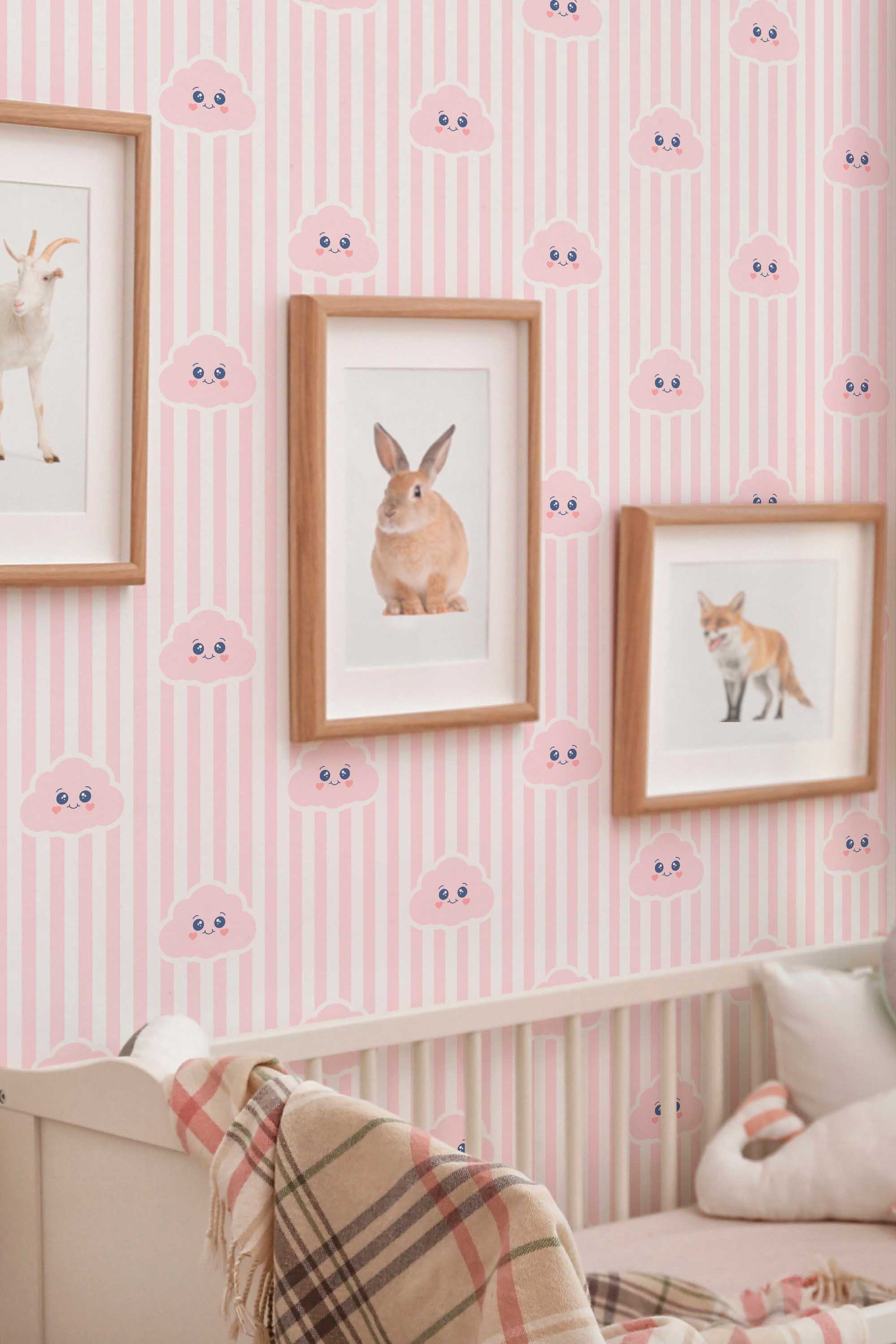 Fancy Walls traditional wallpaper highlighting pink cloud characters with soft striped accents for a charming baby room design.