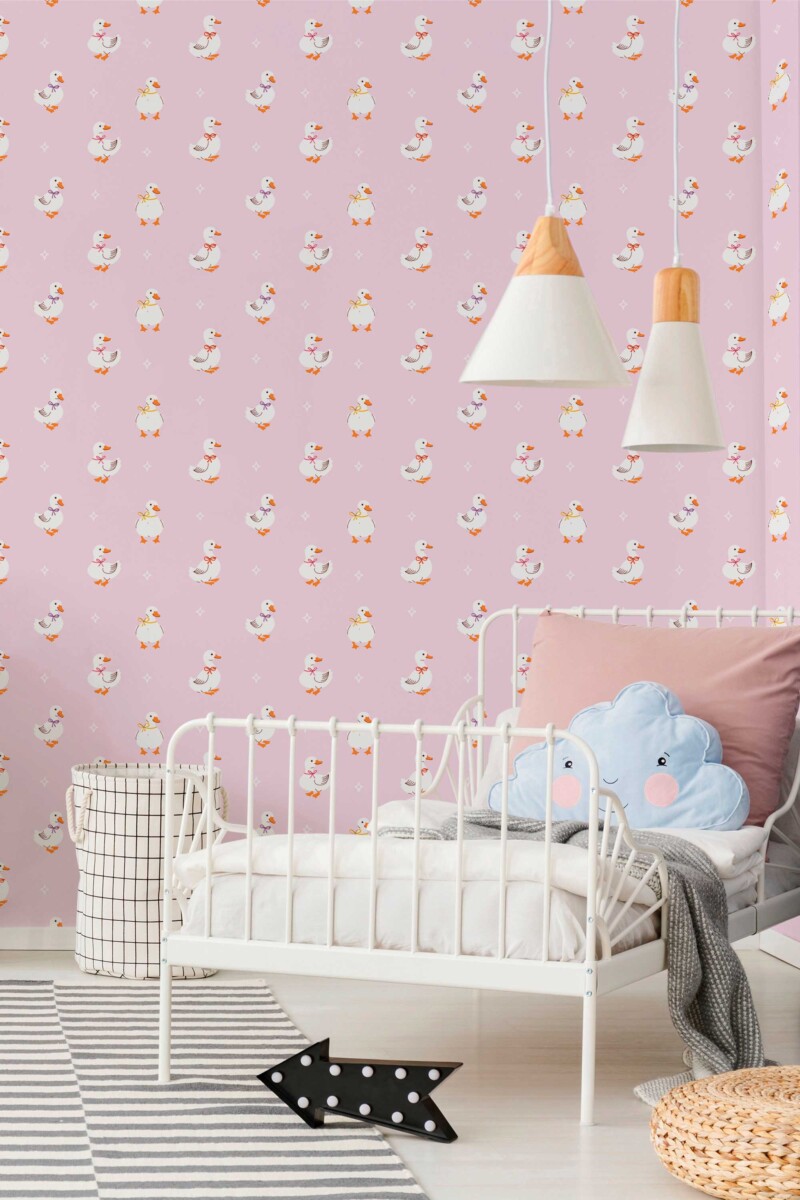 Fancy Walls peel and stick wallpaper with adorable ducklings on a warm pink background for a cute nursery look.