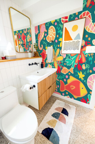 Fancy Walls Playful Ocean peel and stick wall mural with colorful sea life and coral accents in a cheerful underwater theme.