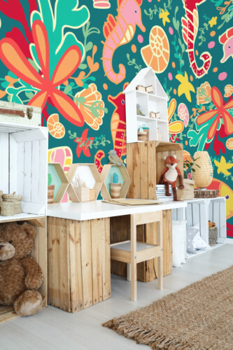 Playful Ocean wall mural peel and stick design by Fancy Walls featuring bright fish, shells, and ocean plants.
