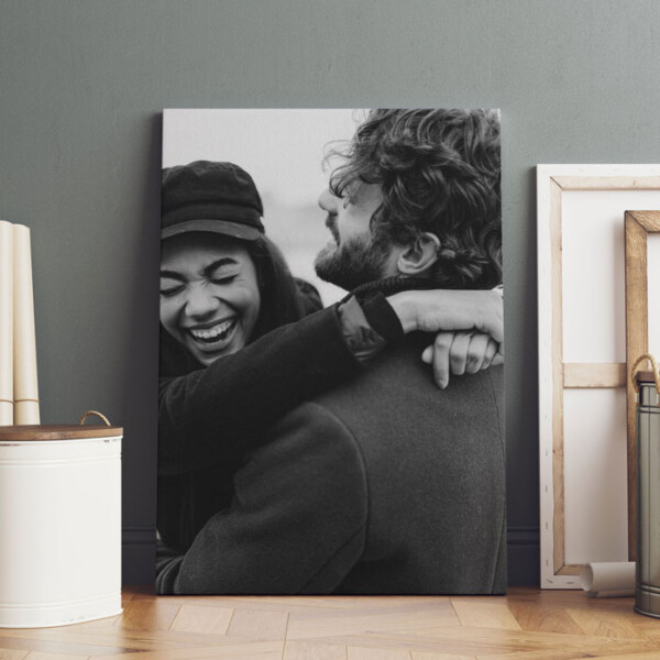 Black and white photo printed on a custom canvas leaning against a wall in a modern interior