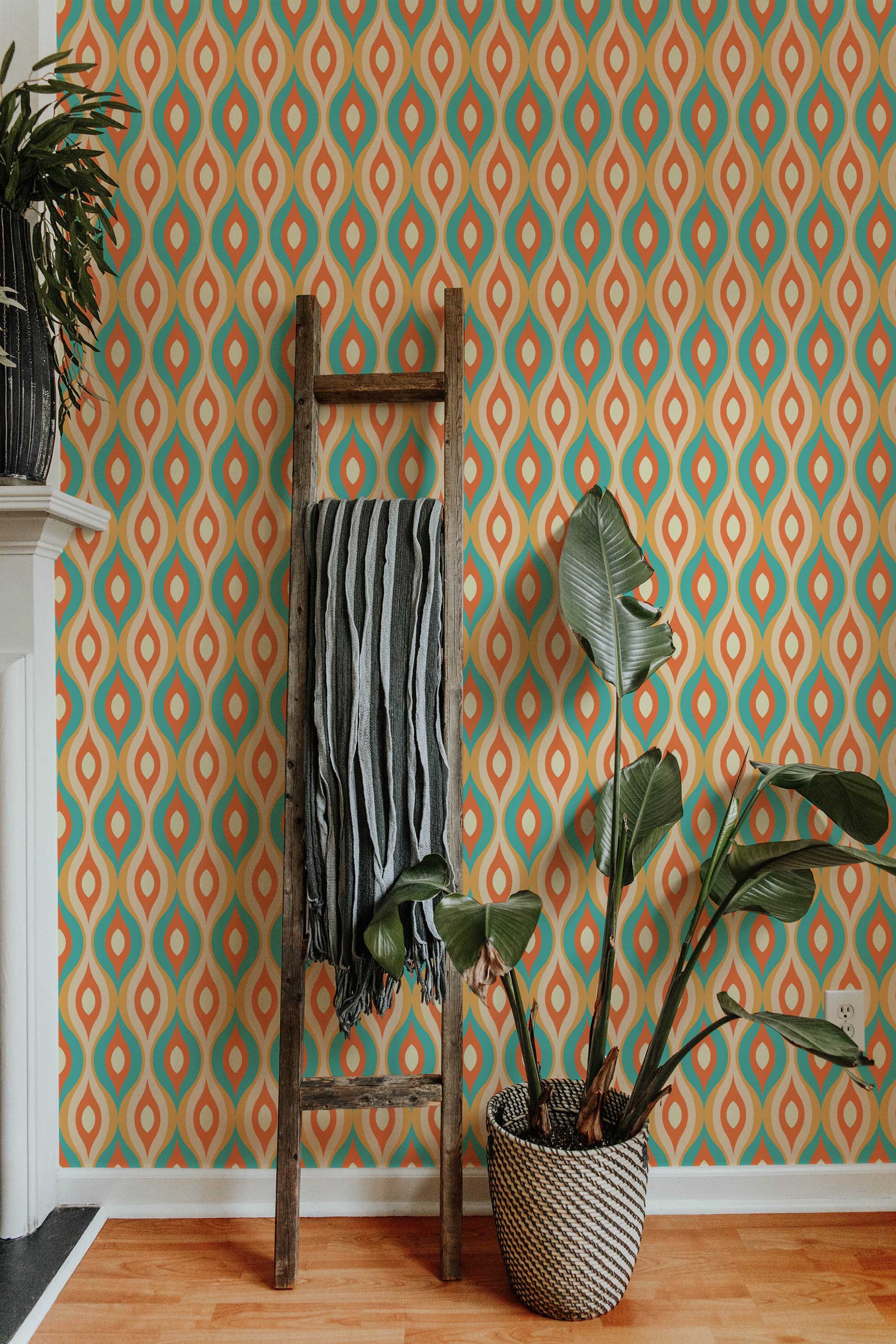 Fancy Walls peel and stick wallpaper with colorful retro leaf motifs in warm orange and green.