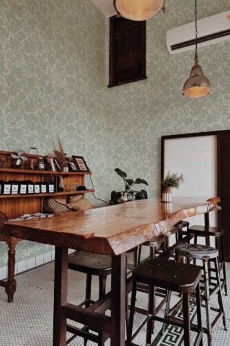 Fancy Walls self-adhesive wallpaper featuring soft green sage florals in a minimal and classy botanical style.