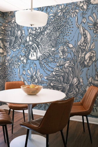 Fancy Walls Vintage Floral Fishes peel and stick wall mural with intricate fish and floral line art on a blue background.