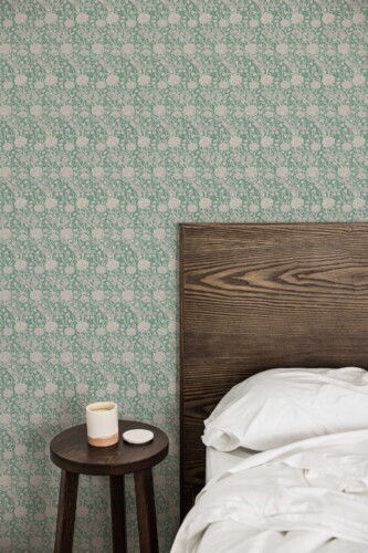 Fancy Walls peel and stick wallpaper with dense green Victorian floral pattern for richly decorated vintage interiors.