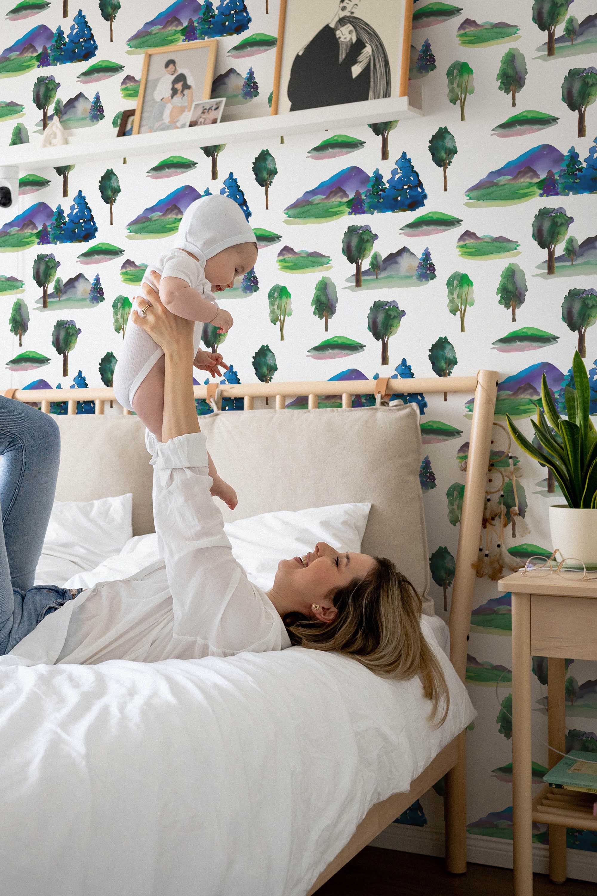 Fancy Walls removable wallpaper showcasing simple repeating watercolor woodland trees perfect for relaxing nature-themed spaces.