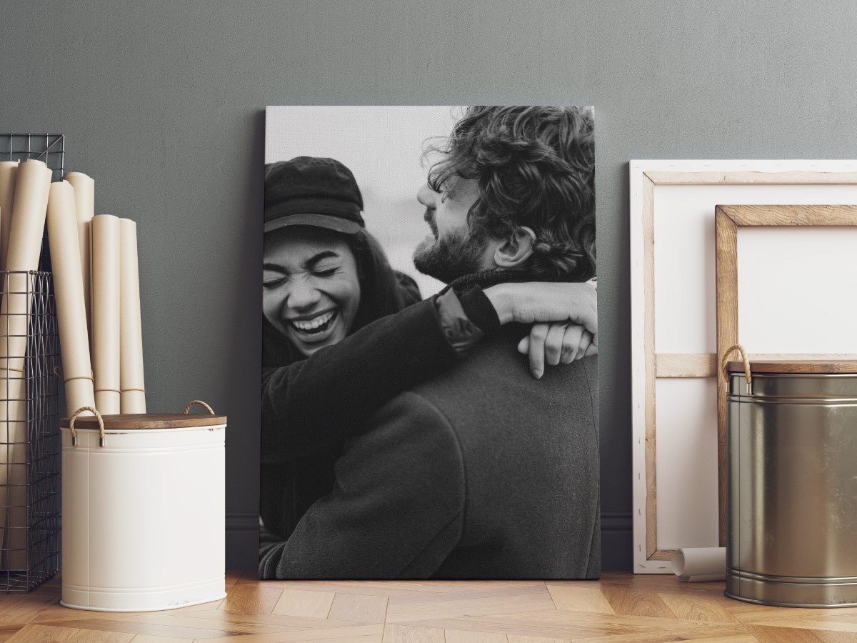 Black and white canvas print showing a happy couple.