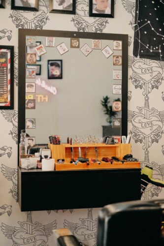 Fancy Walls traditional wallpaper inspired by classic tattoo heart artwork with dagger and wings.