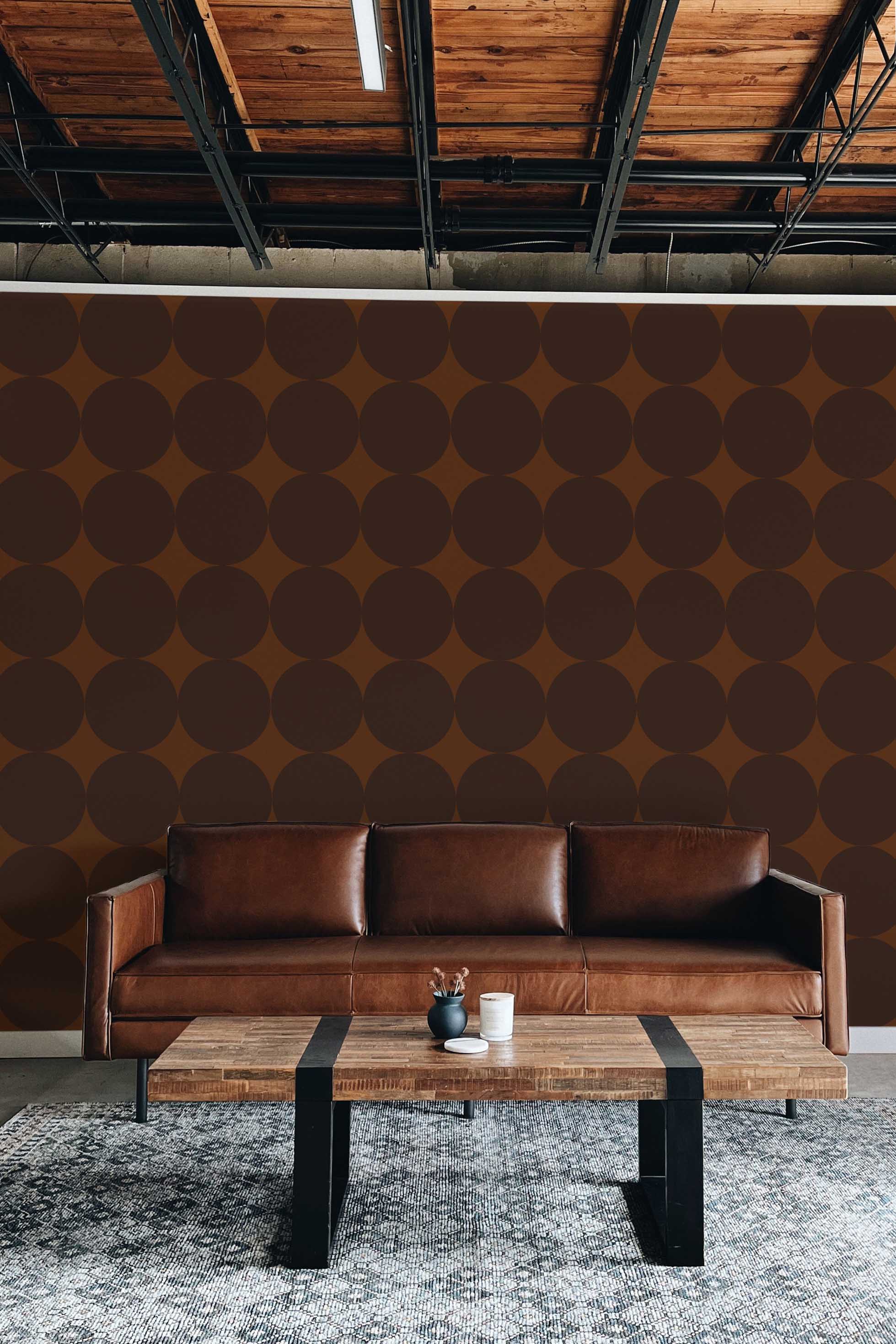 Fancy Walls peel and stick wallpaper with bold brown circles forming a modern geometric repeat.