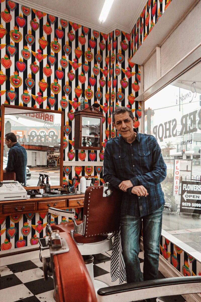 Fancy Walls peel and stick wallpaper with colorful cartoon hearts and flames for a bold Valentine statement.