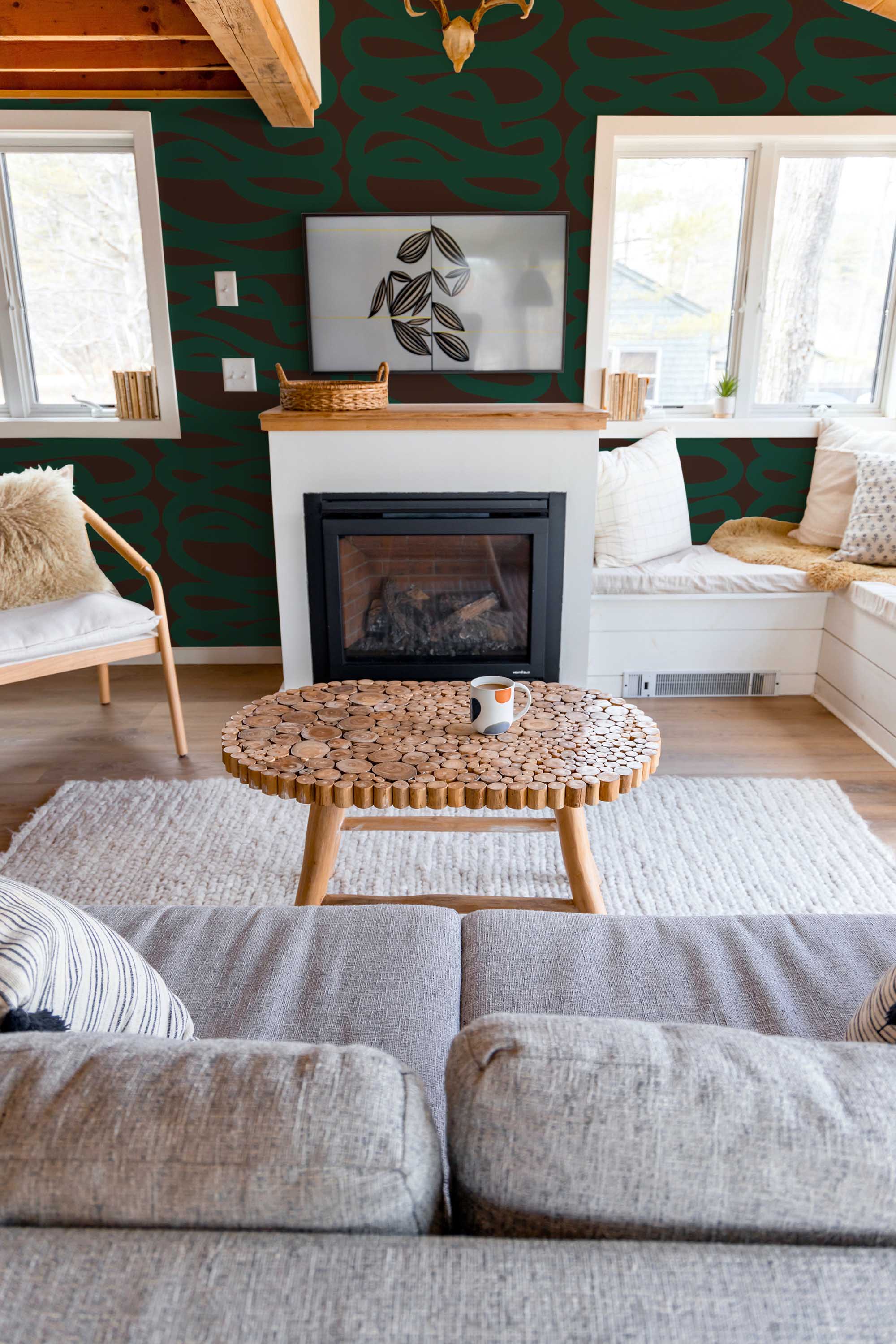 Fancy Walls traditional wallpaper inspired by organic green curves on a dramatic brown backdrop.