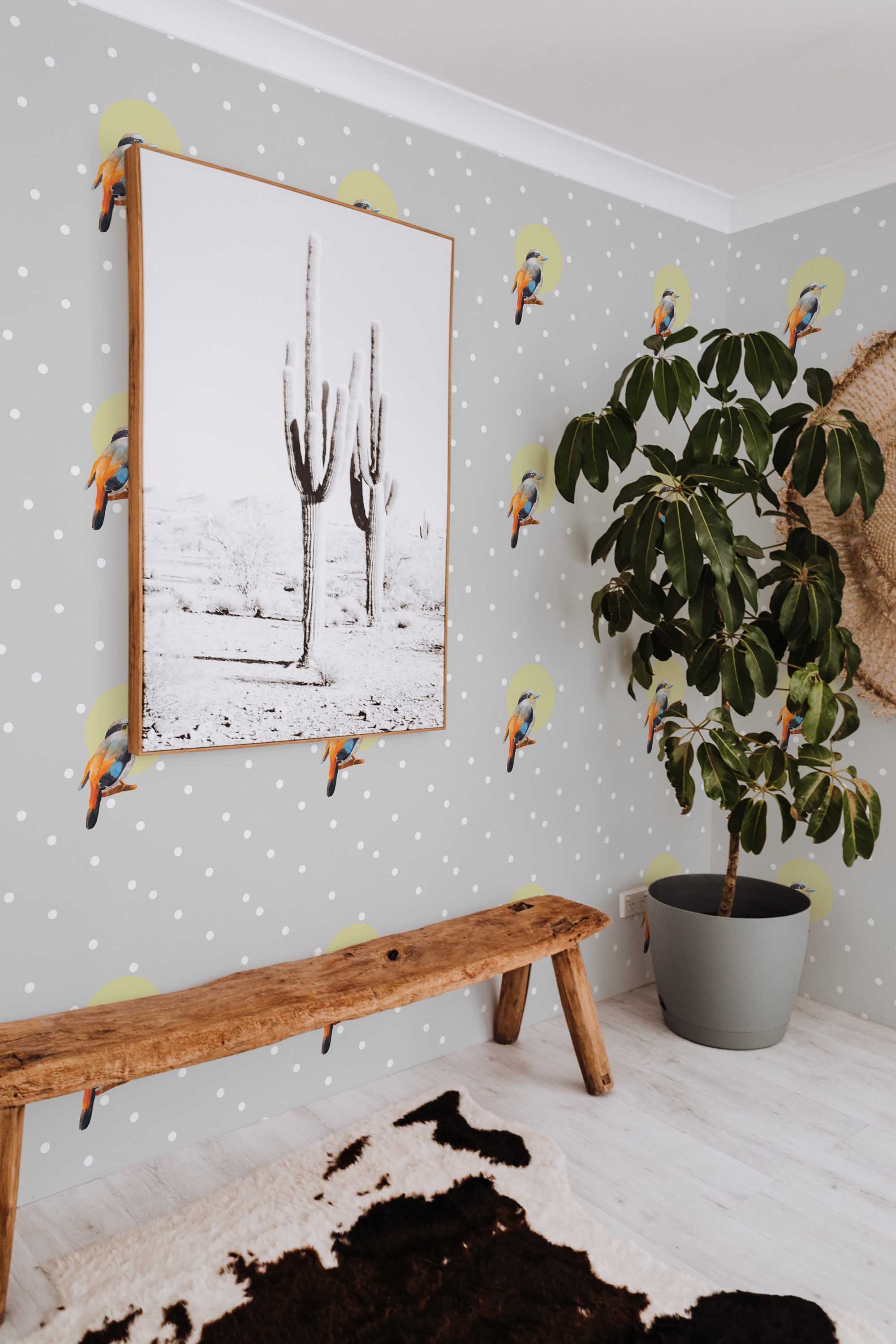 Fancy Walls removable wallpaper showing little birdie motif on a whimsical polka dot background.
